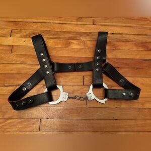 Genuine, leather adjustable chest harness with handcuff detail